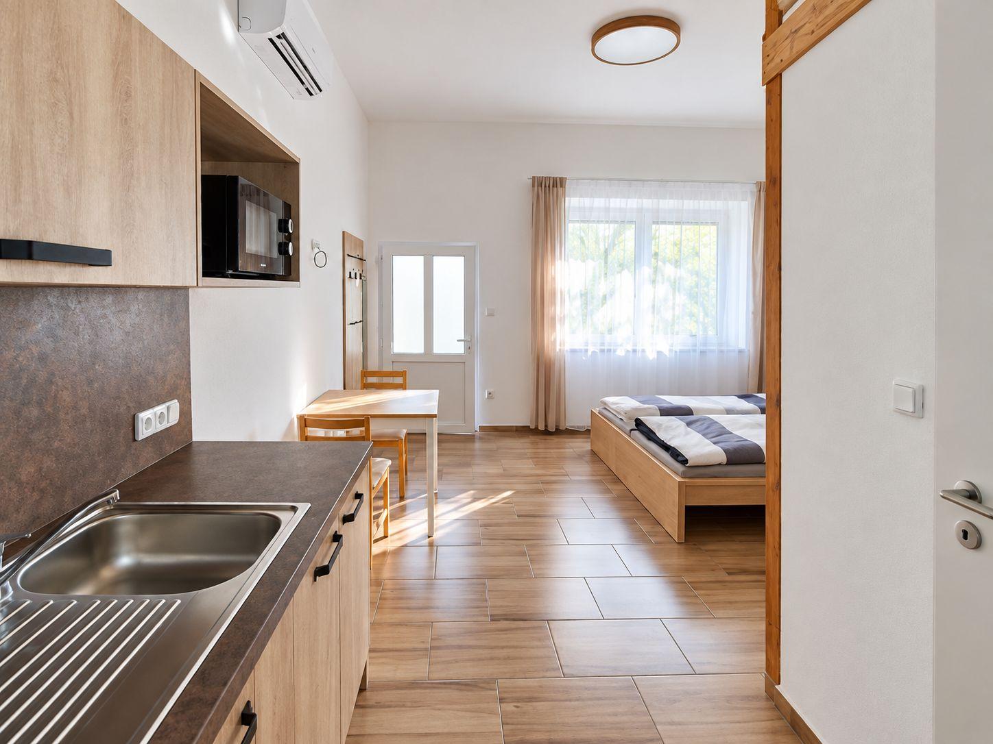 Apartmán Meruňka Čtyřlůžkové studio - Ubytování Zahrada
