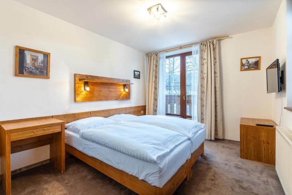 Apartmán Deluxe s 2 spálňami v Rezidencii B - Výhľad na Tatry Apartmán s 2 spálňami - Súkromné Apartmány v Hoteli Kukučka